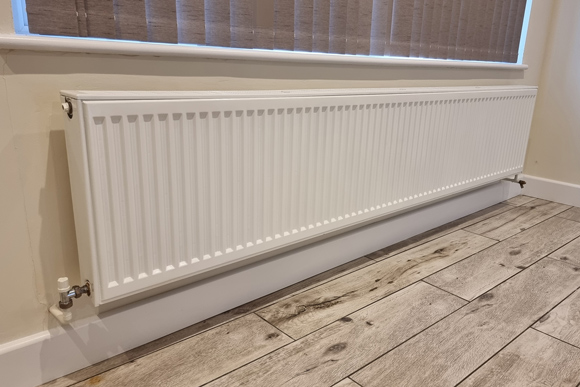 white home radiator installed by JDN Plumbing and Heating