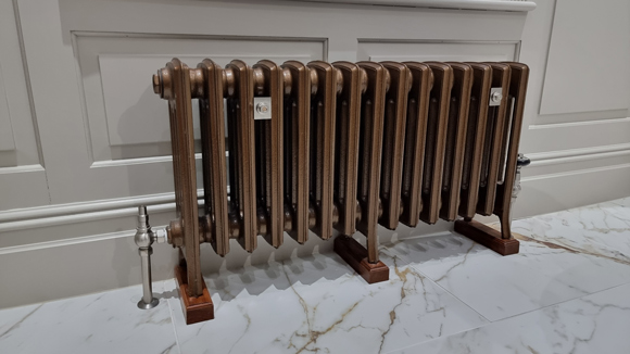 modern brass radiator installed by JDN Plumbing and Heating